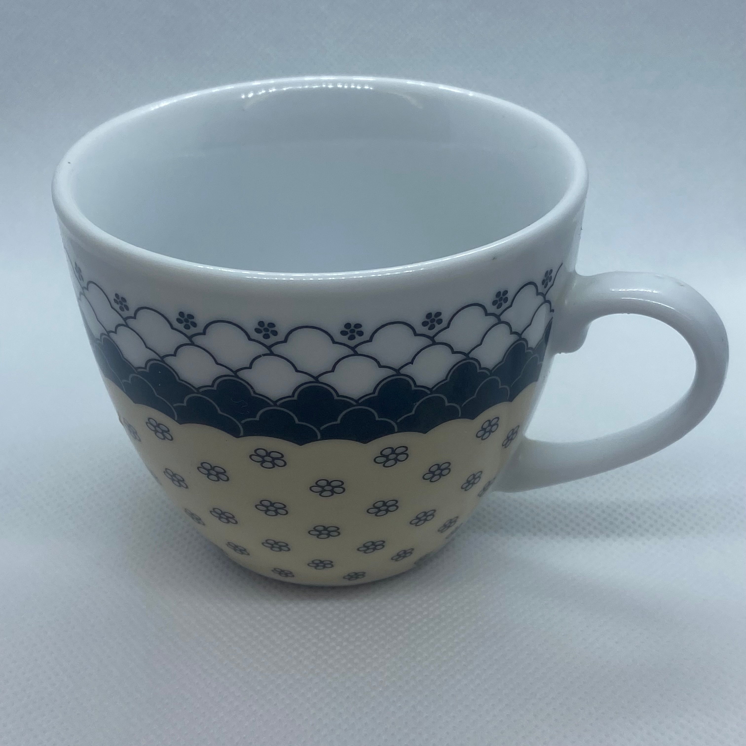 Cup in the up-right position, capturing the inner space at a elevated position