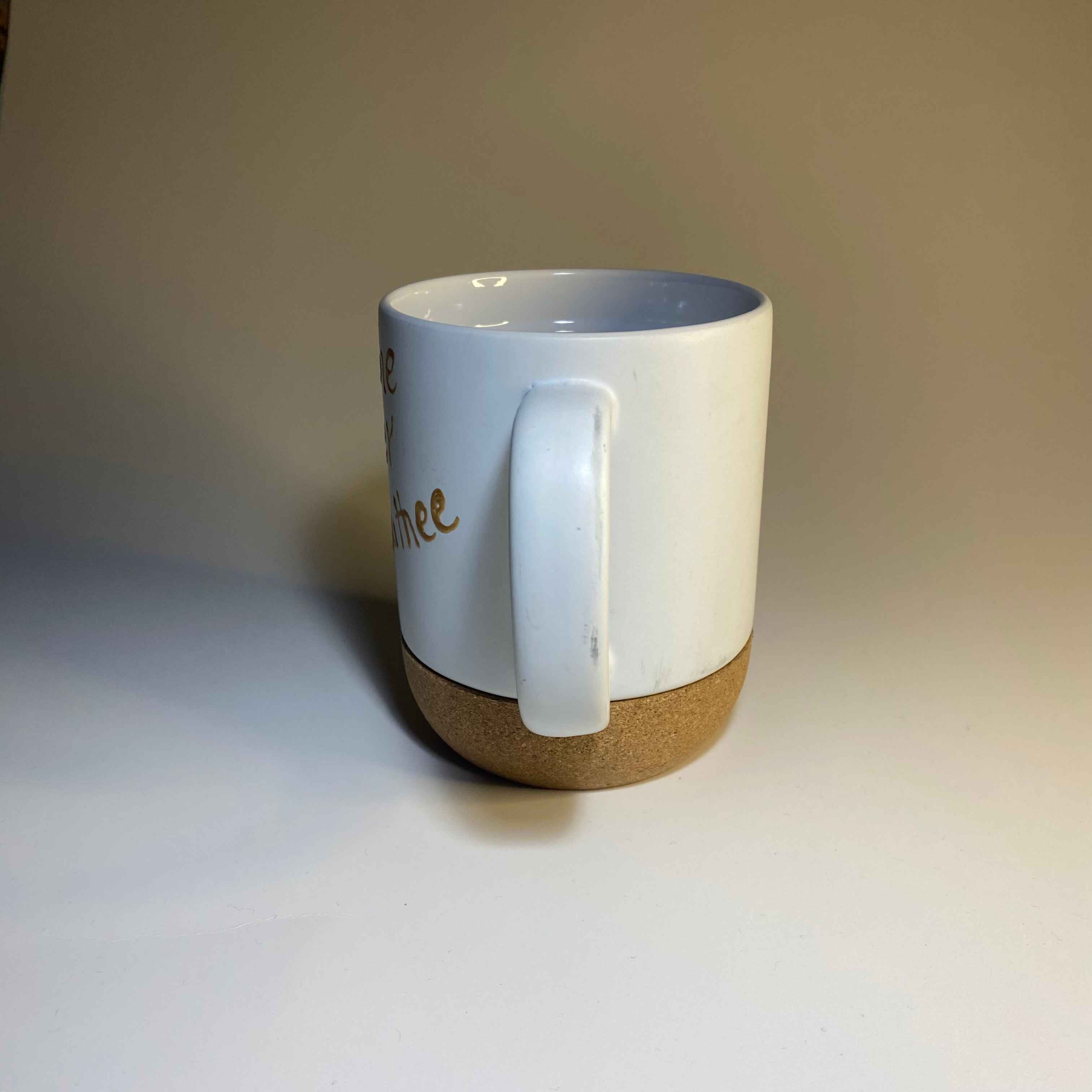 Side profile of the mug shown in front, handle centered