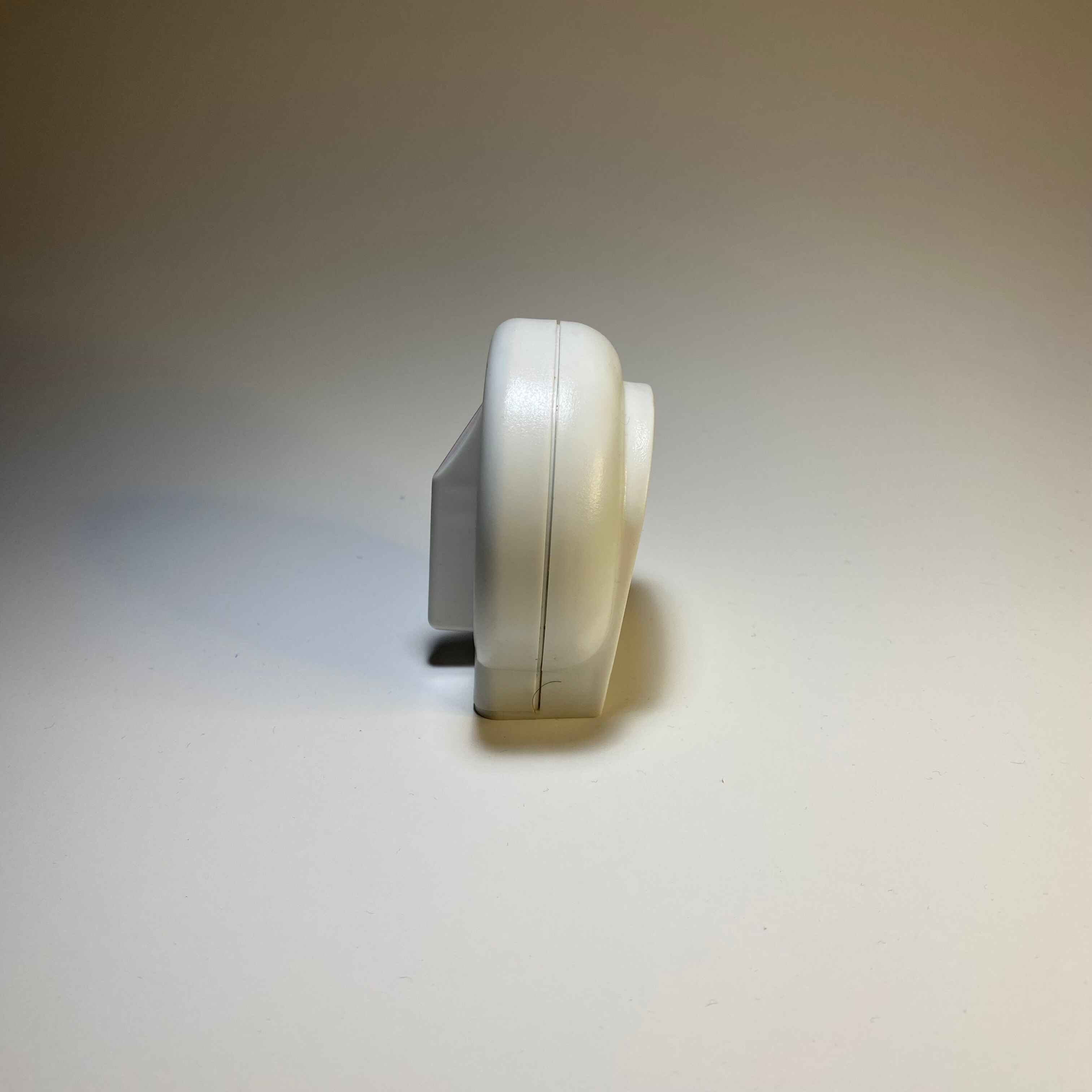 Side view of the timer, displaying the areas the stand out and protrude